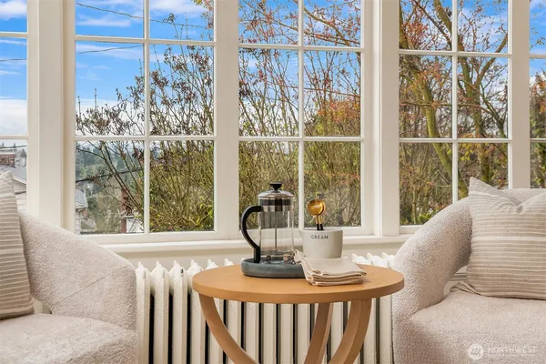 a view of a dining room with furniture window and outside view