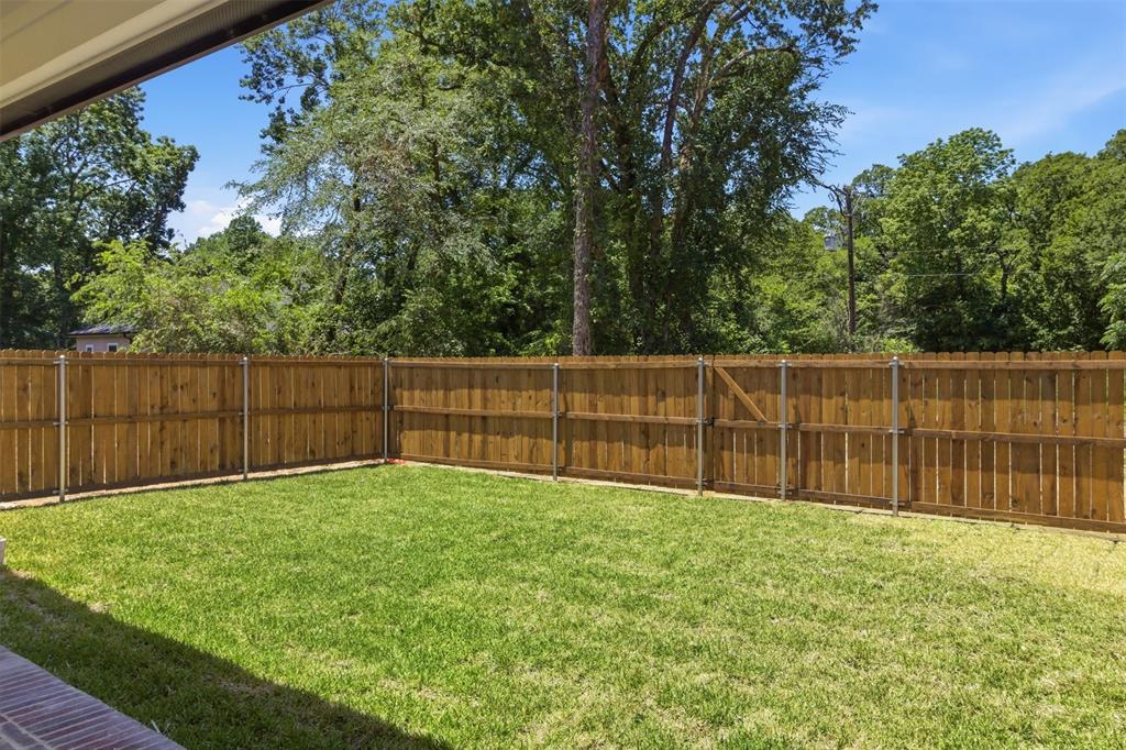 435 Waterboard Road Trinidad, TX 75163 - Photo 37 of 39 Spacious backyard featuring a manicured lawn and a privacy fence with a gate
