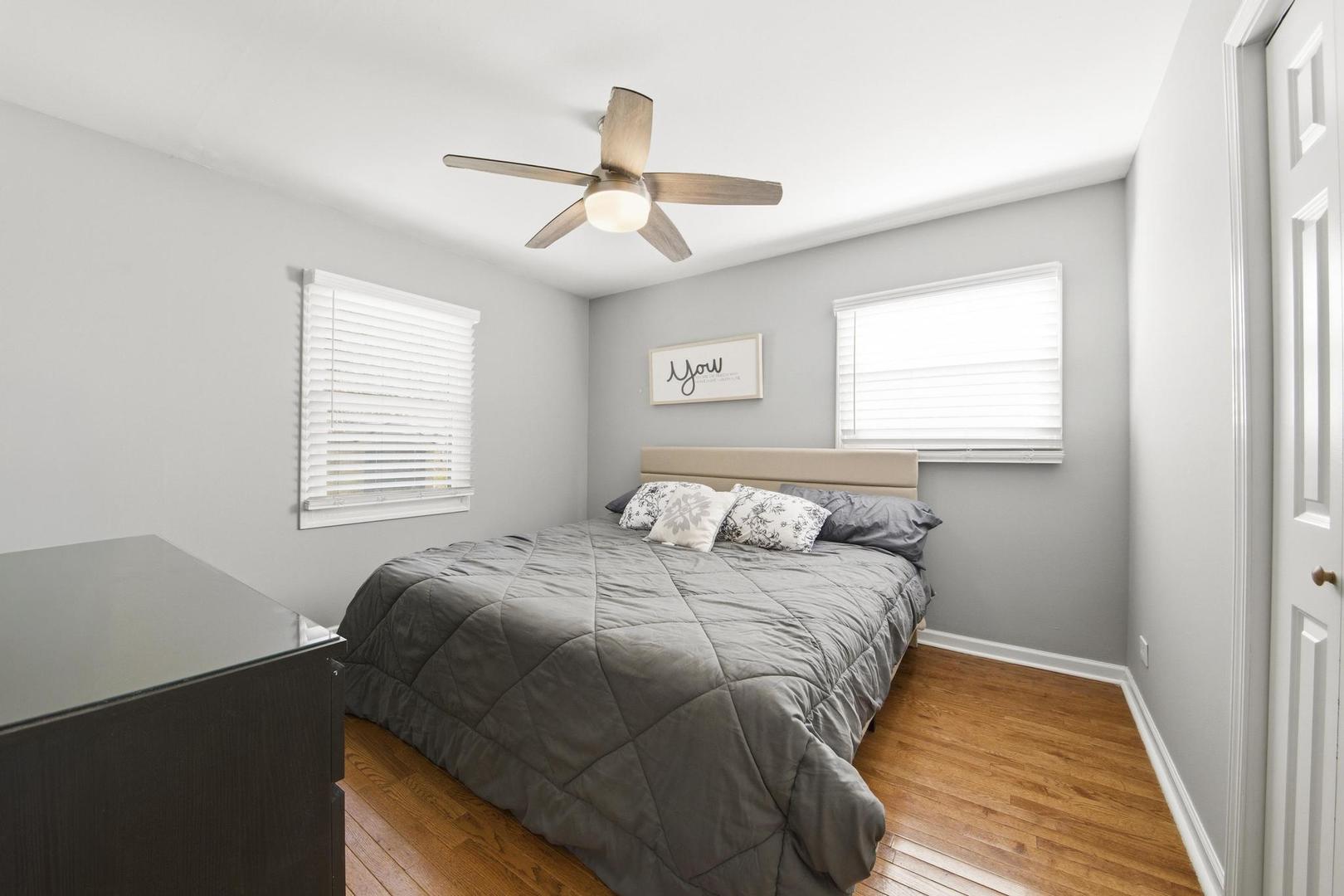 581 Charing Cross Road Elk Grove Village, IL 60007 - Photo 13 of 18 a bedroom with a bed and a window