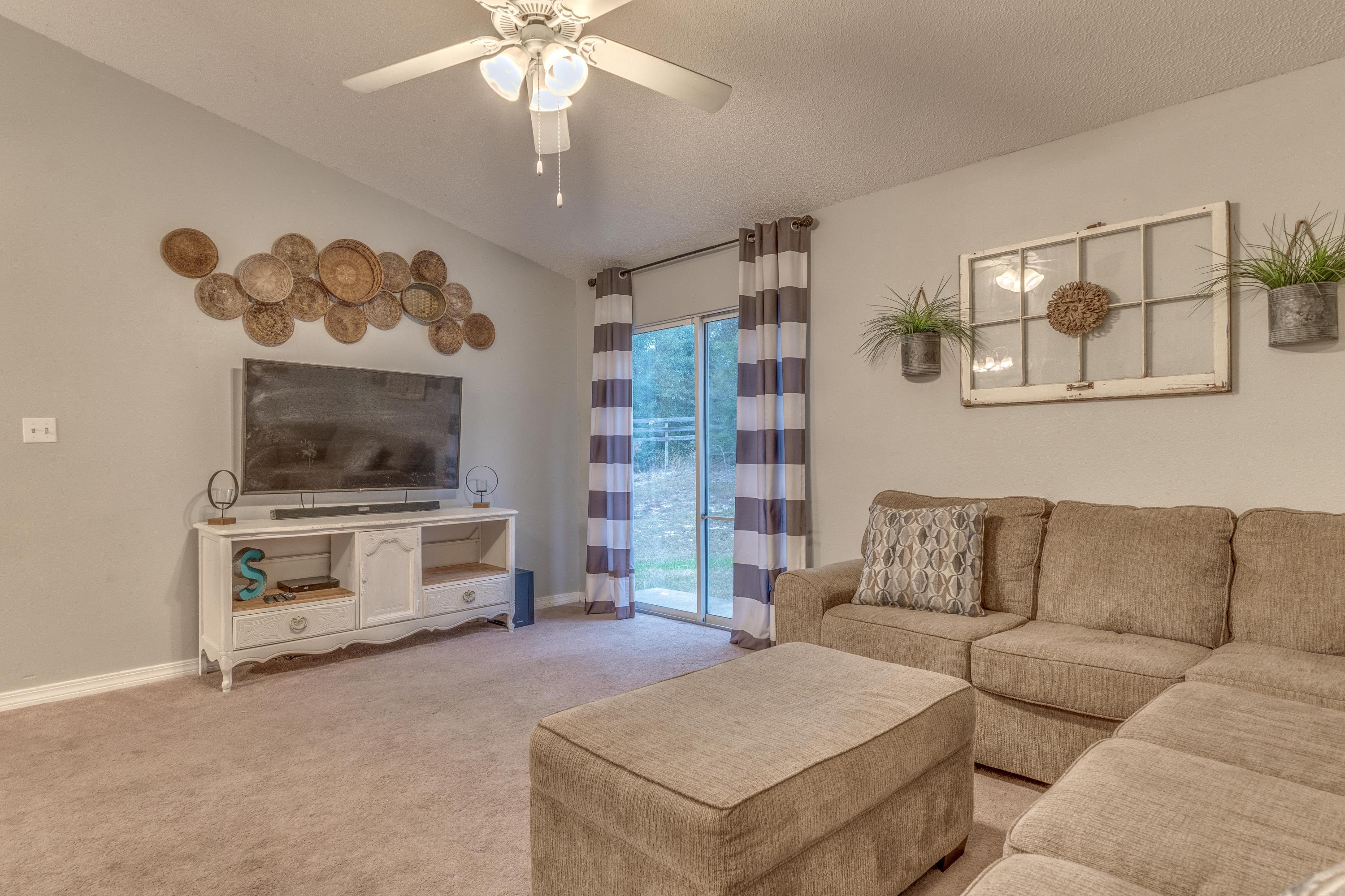 118 Cabana Way Crestview, FL 32536 - Photo 16 of 22 a living room with furniture and a flat screen tv