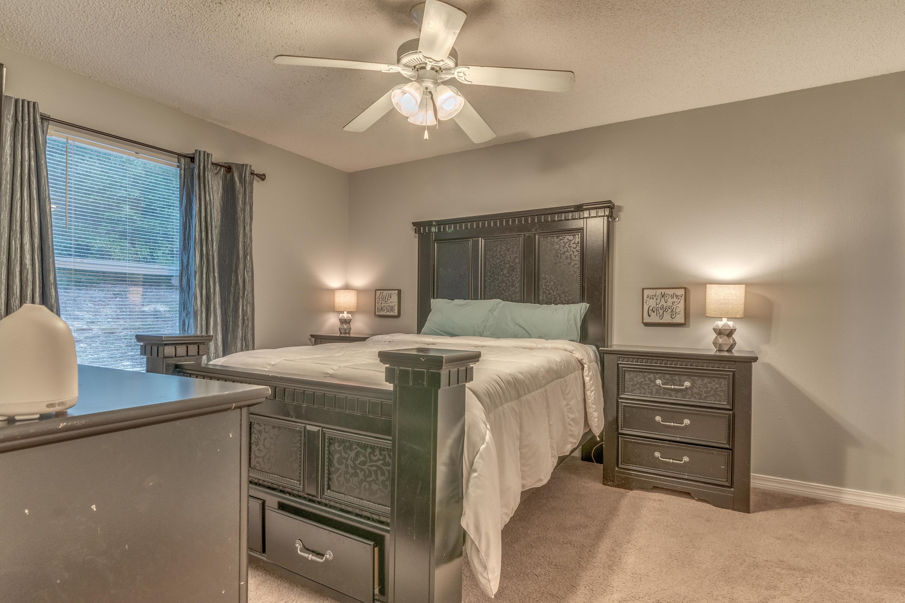 118 Cabana Way Crestview, FL 32536 - Photo 17 of 22 a bedroom with a bed and a chandelier