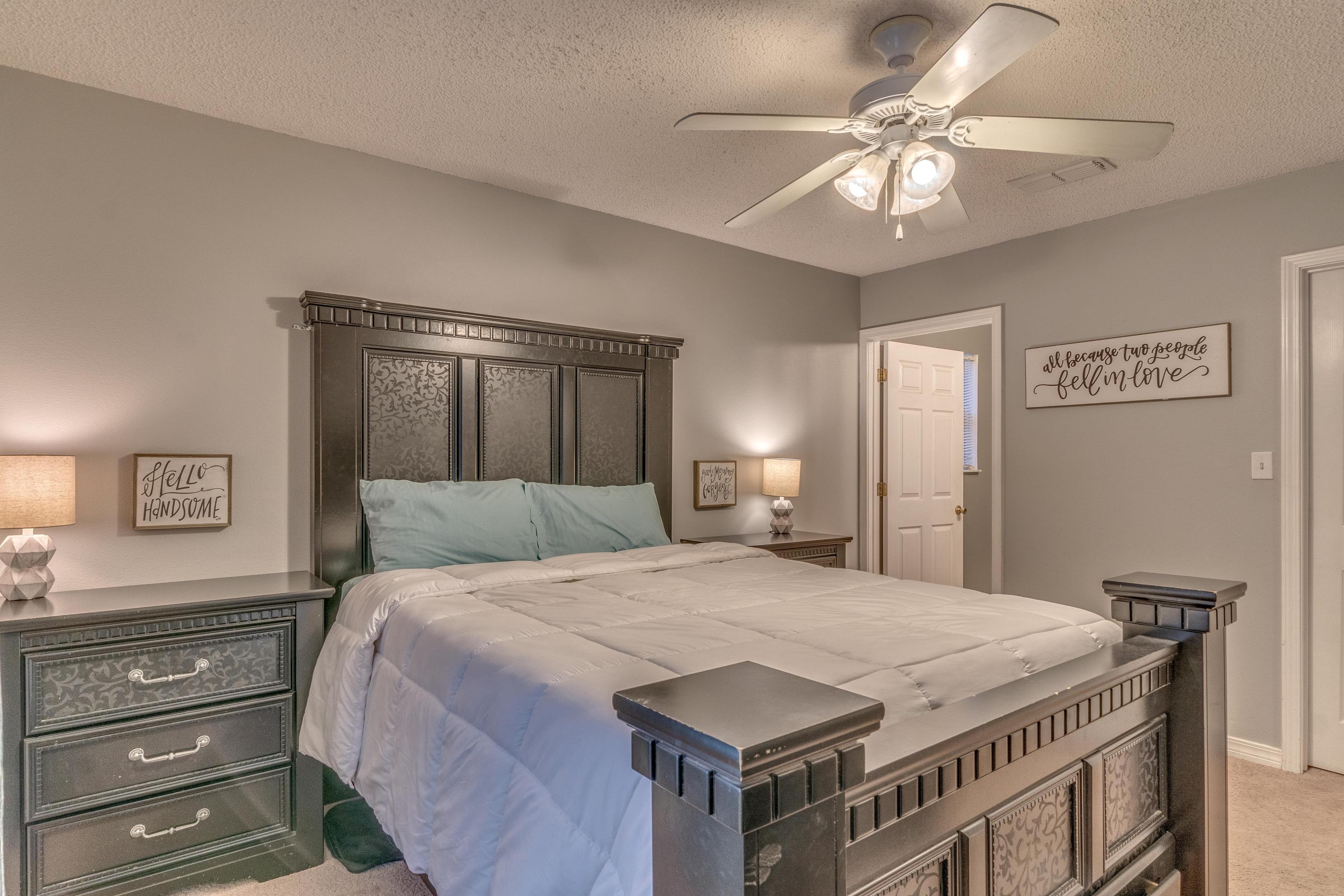 118 Cabana Way Crestview, FL 32536 - Photo 18 of 22 a bedroom with a bed and a chandelier