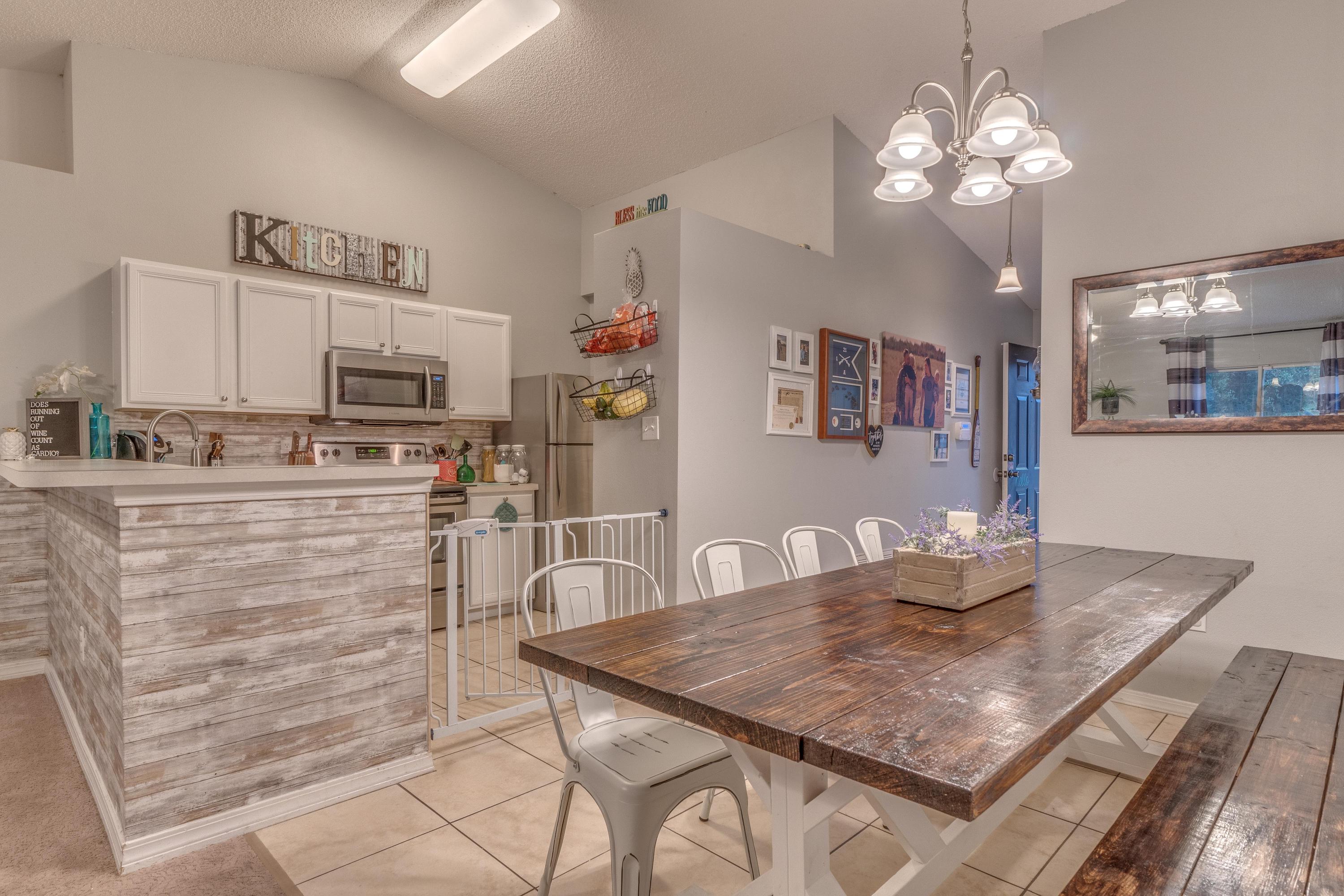 118 Cabana Way Crestview, FL 32536 - Photo 3 of 22 a kitchen with kitchen island stainless steel appliances a dining table and chairs