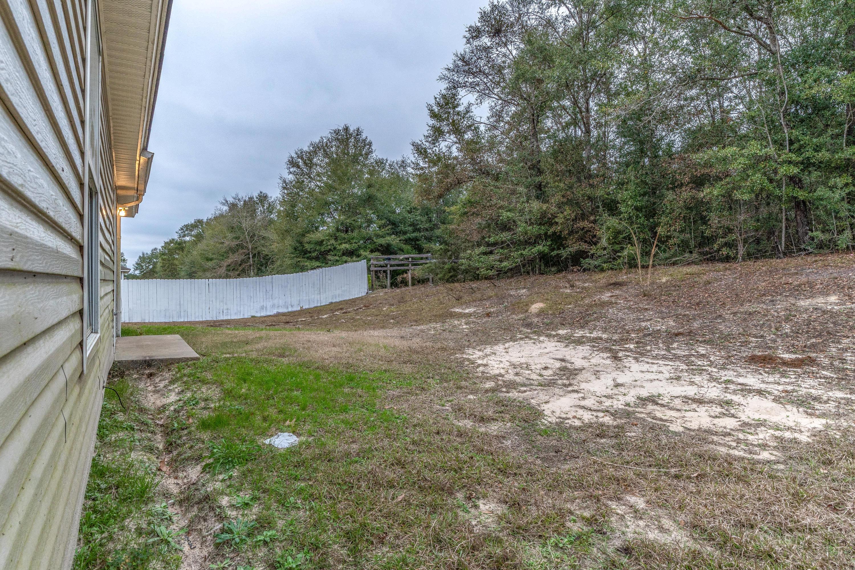 118 Cabana Way Crestview, FL 32536 - Photo 21 of 22 a view of backyard with tree