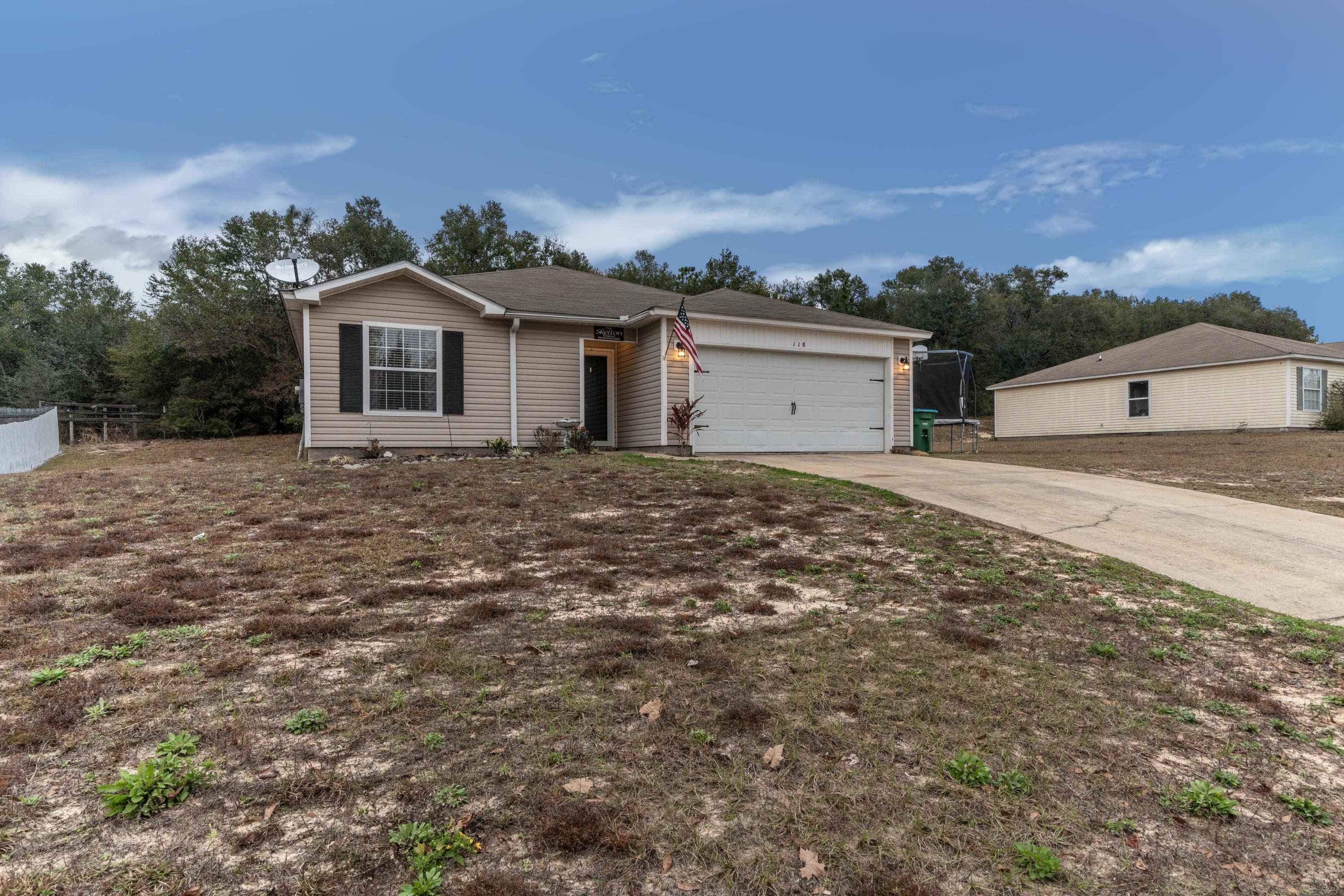 118 Cabana Way Crestview, FL 32536 - Photo 22 of 22 a front view of a house with a yard