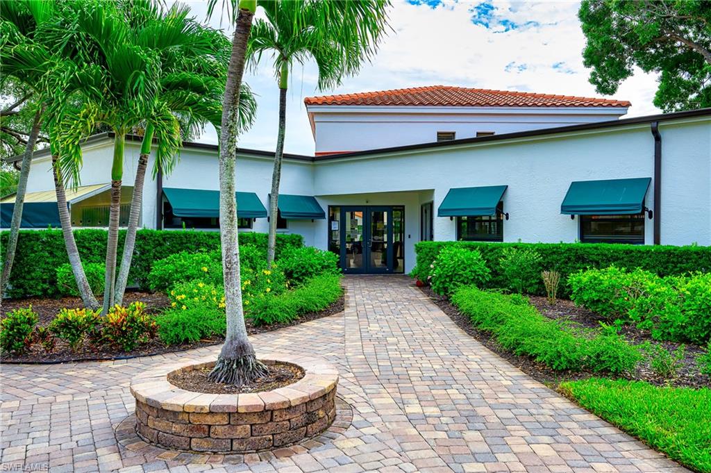 719 Reef Point Circle, Unit 13 Naples, FL 34108 - Photo 29 of 29 a view of a house with a fountain and a fountain