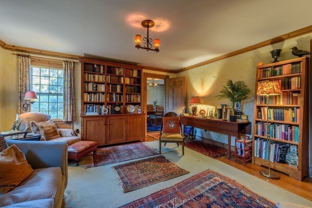88 Farview Way Amherst, MA 01002 - Photo 12 of 25 a living room with furniture a rug and a book shelf