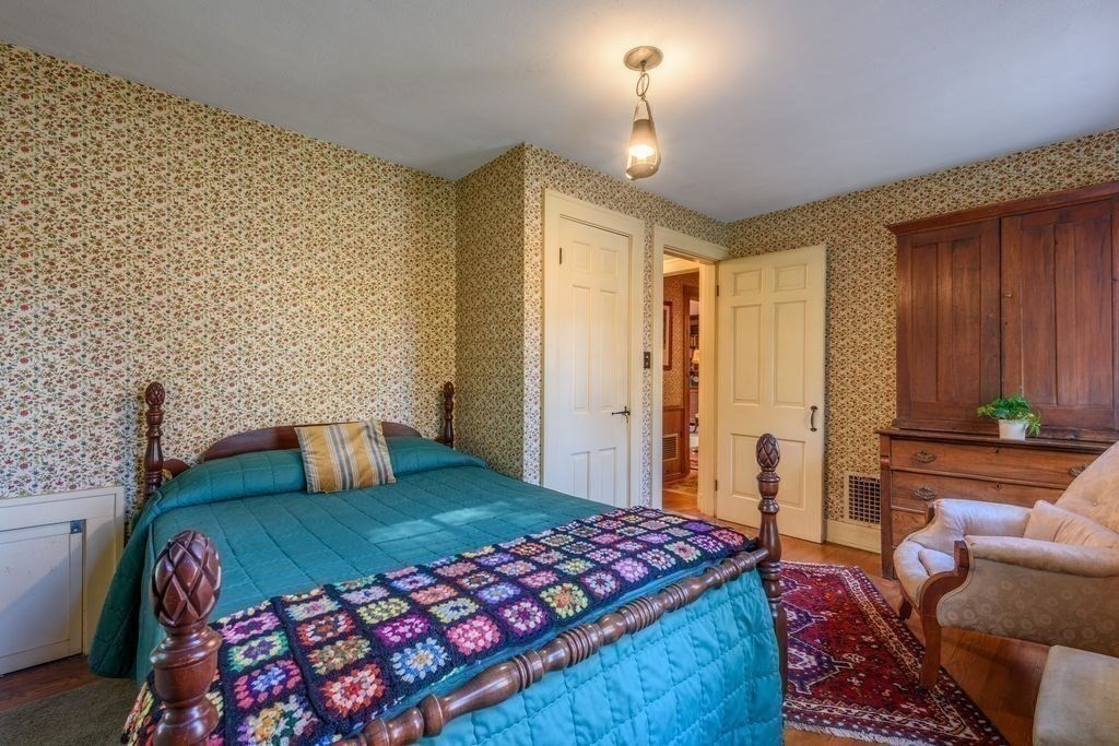 88 Farview Way Amherst, MA 01002 - Photo 14 of 25 a bedroom with a bed and a lamp with dresser