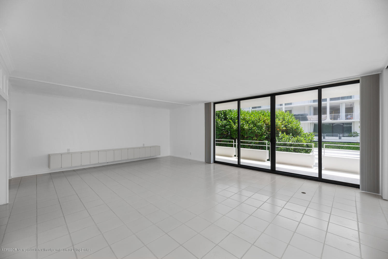 2150 Ibis Isle Road, Unit 8 Palm Beach, FL 33480 - Photo 11 of 31 a view of an empty room with a large window