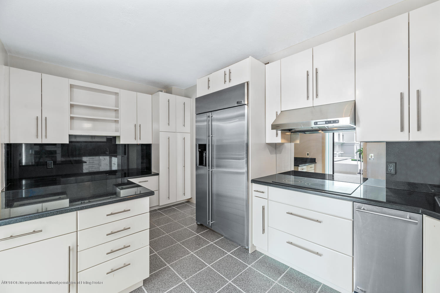2150 Ibis Isle Road, Unit 8 Palm Beach, FL 33480 - Photo 14 of 31 a kitchen with granite countertop white cabinets and stainless steel appliances