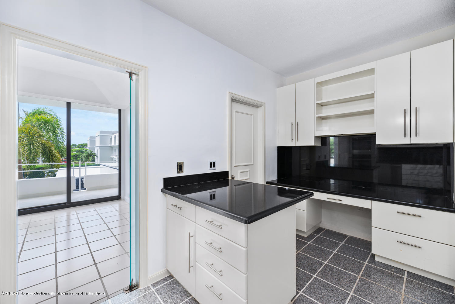 2150 Ibis Isle Road, Unit 8 Palm Beach, FL 33480 - Photo 15 of 31 a kitchen with granite countertop a sink and a stove top oven