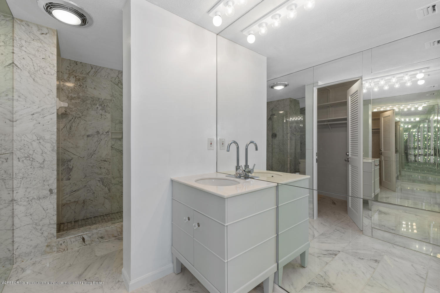 2150 Ibis Isle Road, Unit 8 Palm Beach, FL 33480 - Photo 21 of 31 a bathroom with a sink and a mirror