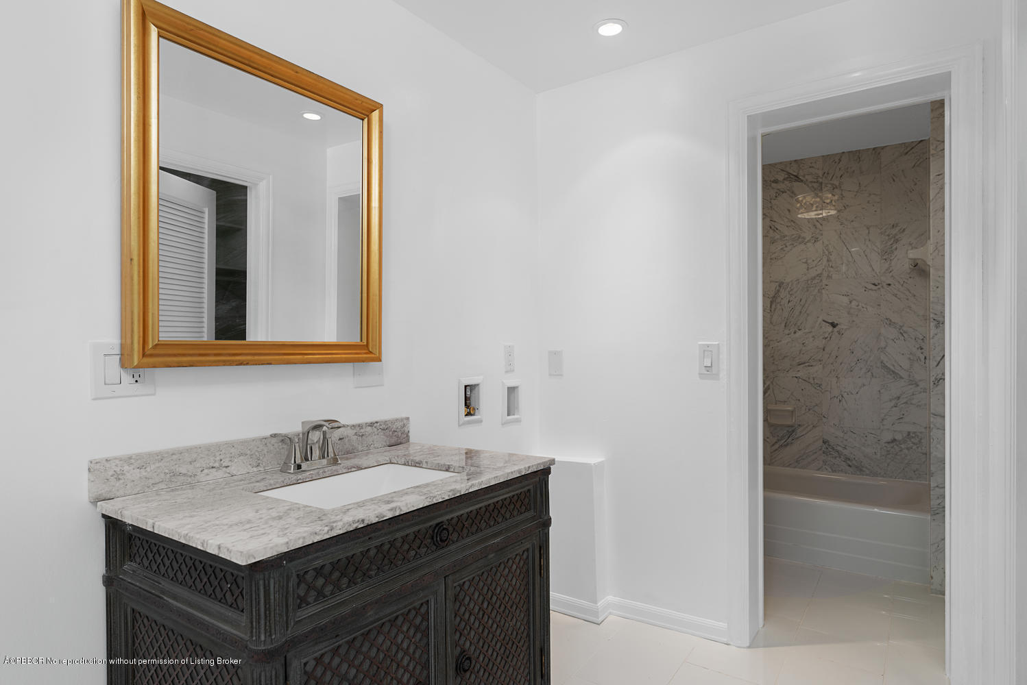 2150 Ibis Isle Road, Unit 8 Palm Beach, FL 33480 - Photo 24 of 31 a bathroom with a granite countertop sink and a mirror