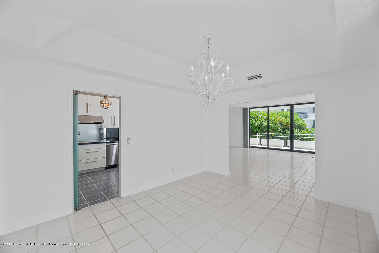 2150 Ibis Isle Road, Unit 8 Palm Beach, FL 33480 - Photo 6 of 31 a big room with windows and chandelier