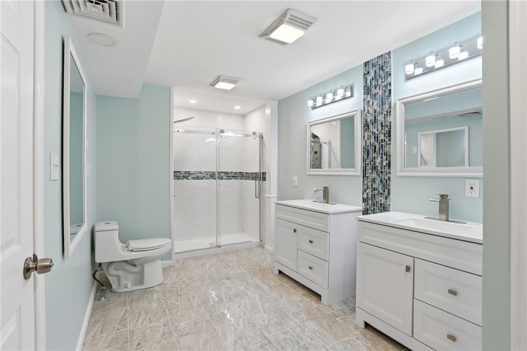 6271 Batman Road Zionsville, PA 18092 - Photo 51 of 100 A well-appointed bath features a spacious shower and twin vanities, creating a tranquil and functional space.