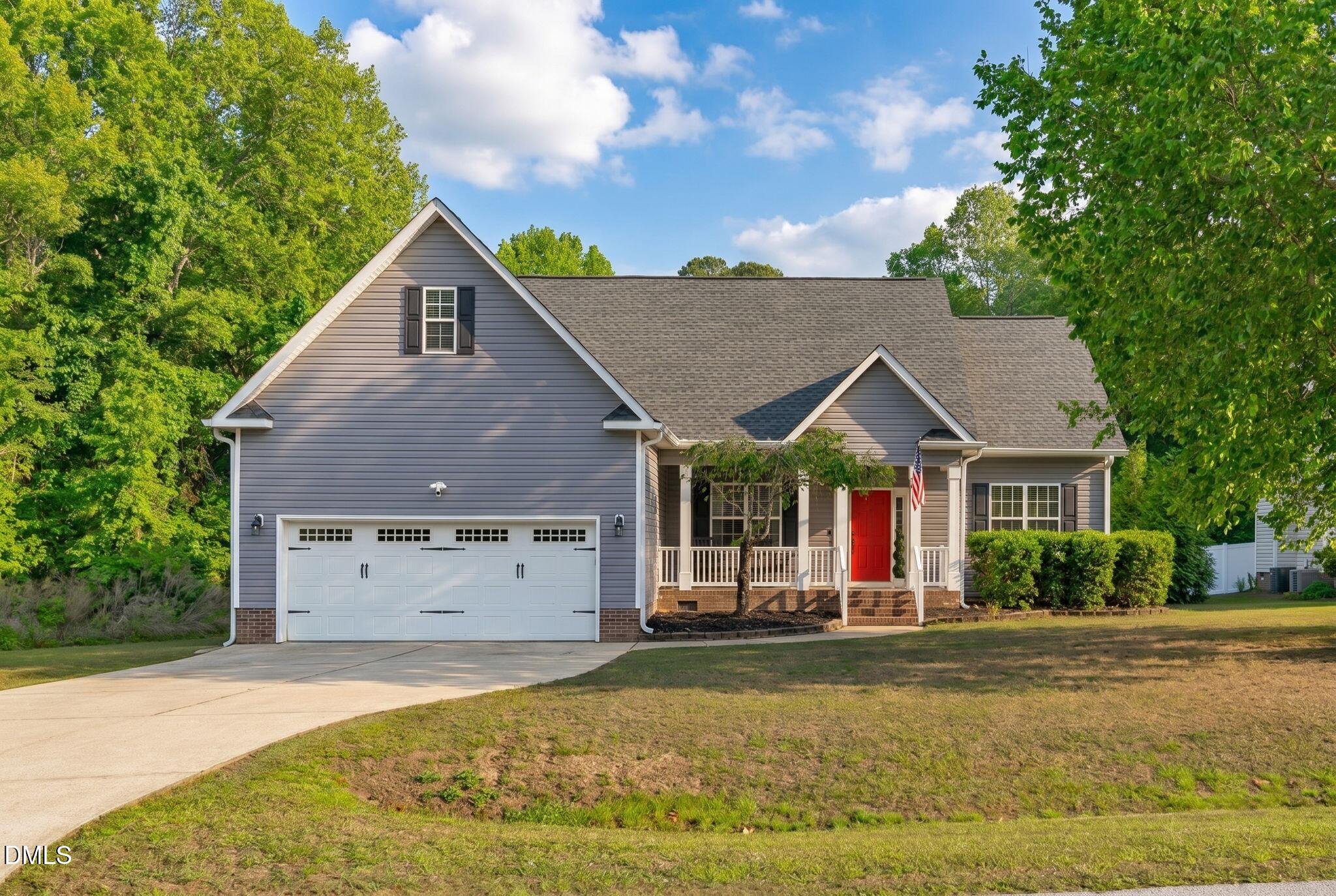 2450 Rolling Tracks Road Willow Spring, NC 27592 - Photo 1 of 64 a view of house with garden space and swimming pool