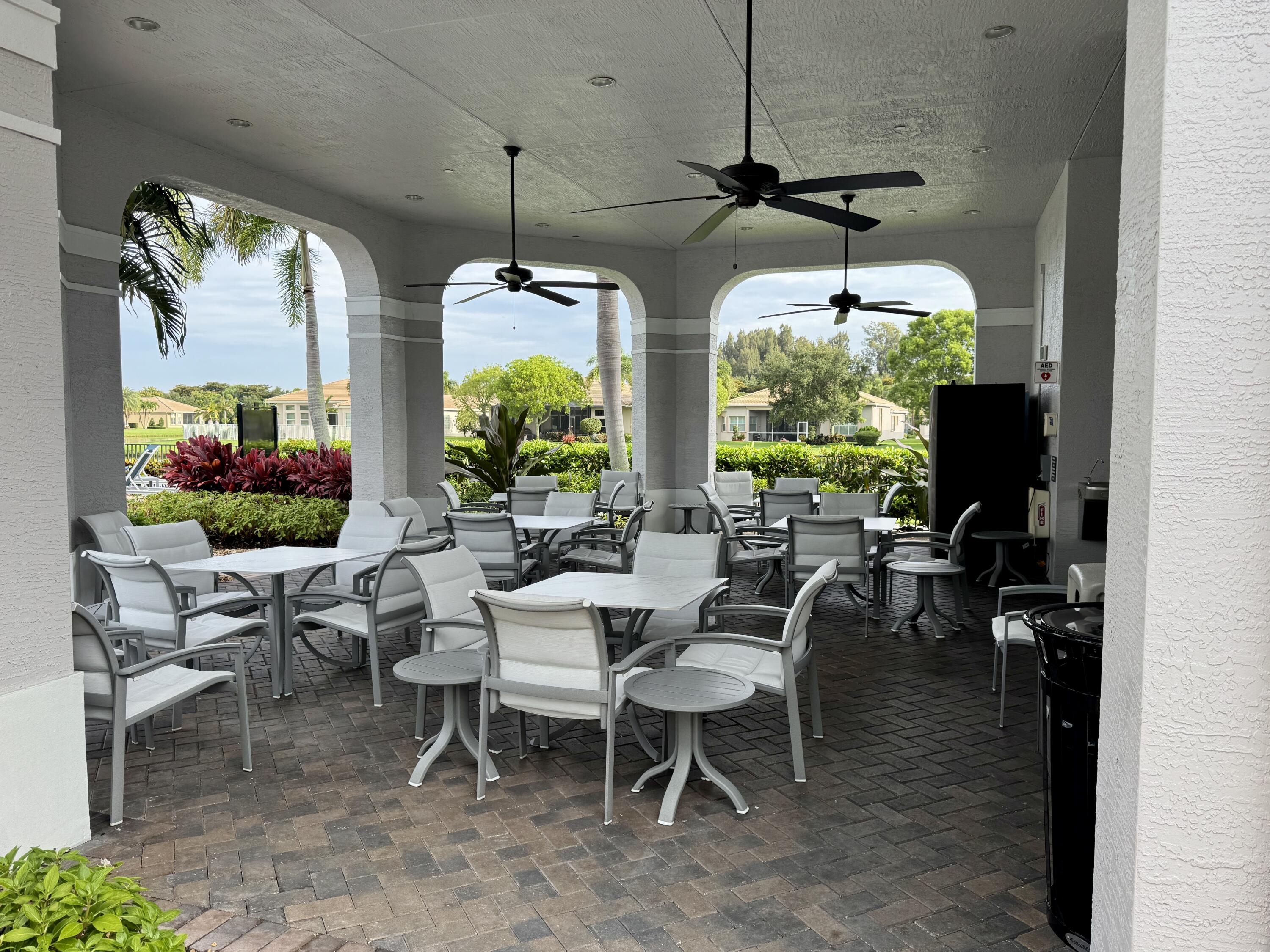 9385 Ivory Isle Road Boynton Beach, FL 33473 - Photo 34 of 50 a view of a dining room with furniture window and outside view