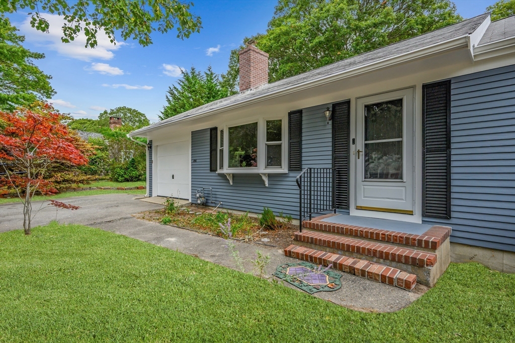 296 Buckskin Path Barnstable, MA 02632 - Photo 22 of 32 front view of house with a yard