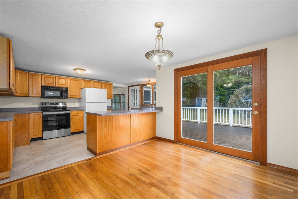 296 Buckskin Path Barnstable, MA 02632 - Photo 4 of 32 a view of a kitchen with a sink stove and a window