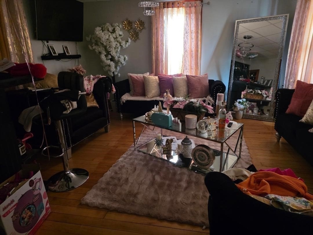 306 Franklin Road Fitchburg, MA 01420 - Photo 11 of 32 a living room with furniture and a wooden floor