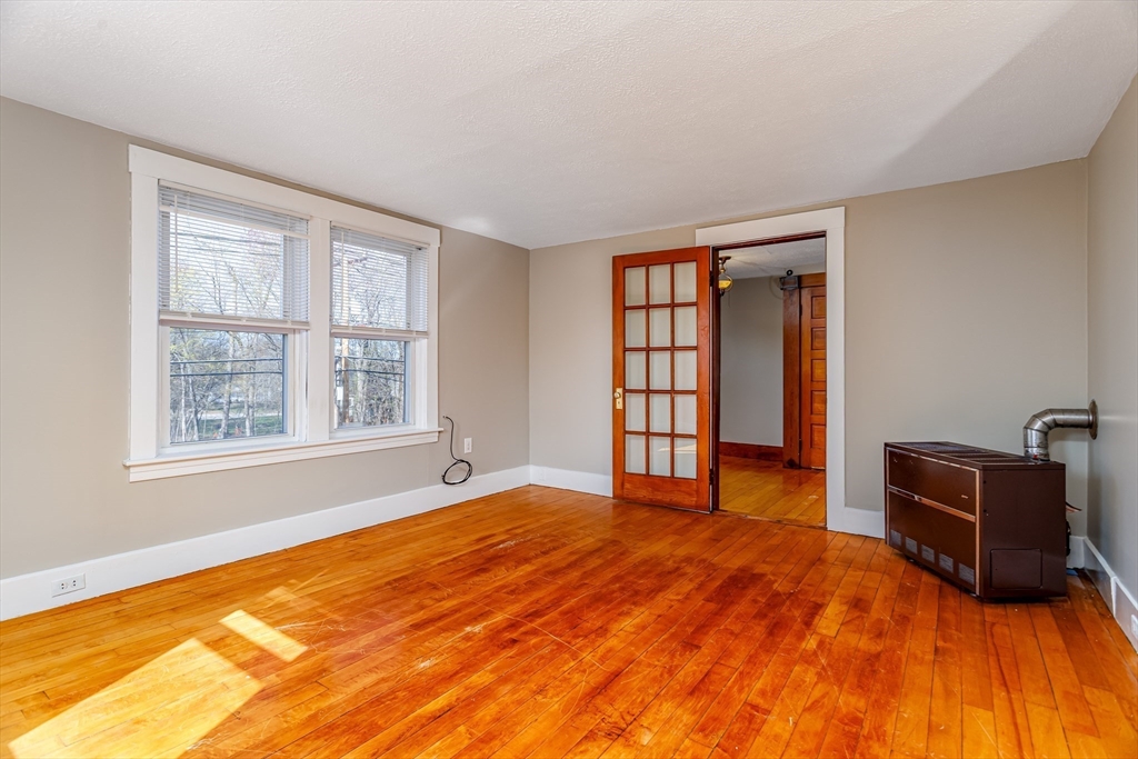 306 Franklin Road Fitchburg, MA 01420 - Photo 16 of 32 a bedroom with a bed and window