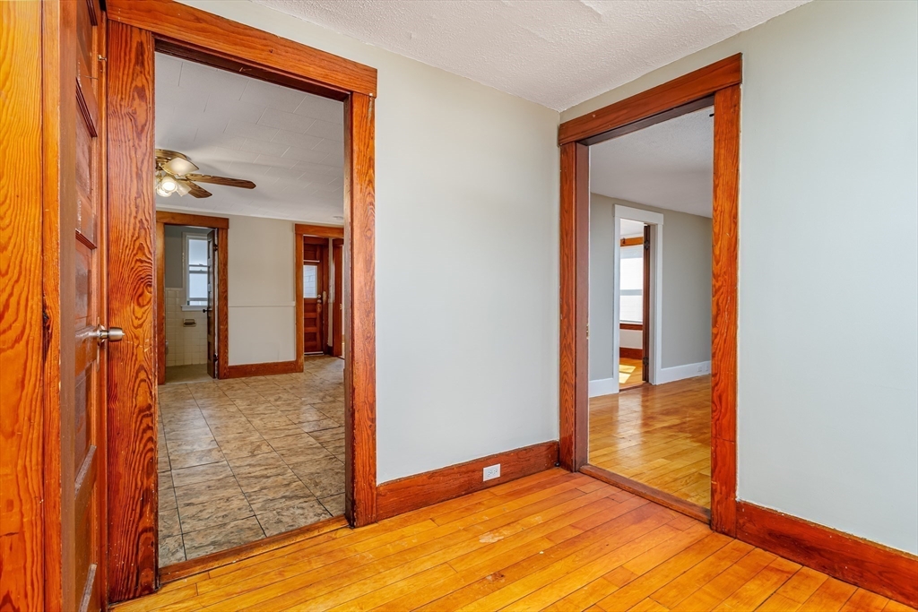 306 Franklin Road Fitchburg, MA 01420 - Photo 24 of 32 a view of a hallway with wooden floor