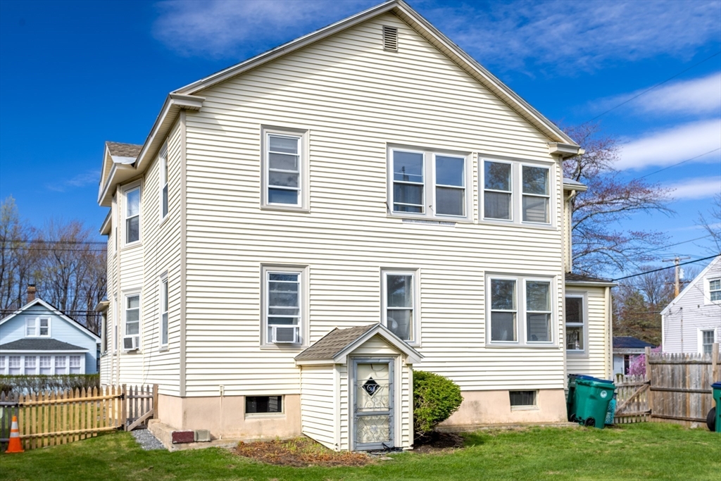 306 Franklin Road Fitchburg, MA 01420 - Photo 32 of 32 a front view of a house with a yard and garage