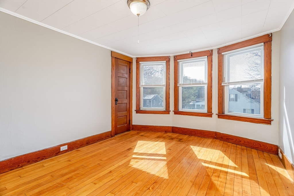 306 Franklin Road Fitchburg, MA 01420 - Photo 4 of 32 a view of an empty room with a window