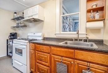 306 Franklin Road Fitchburg, MA 01420 - Photo 8 of 32 a kitchen with stainless steel appliances granite countertop a sink and a stove