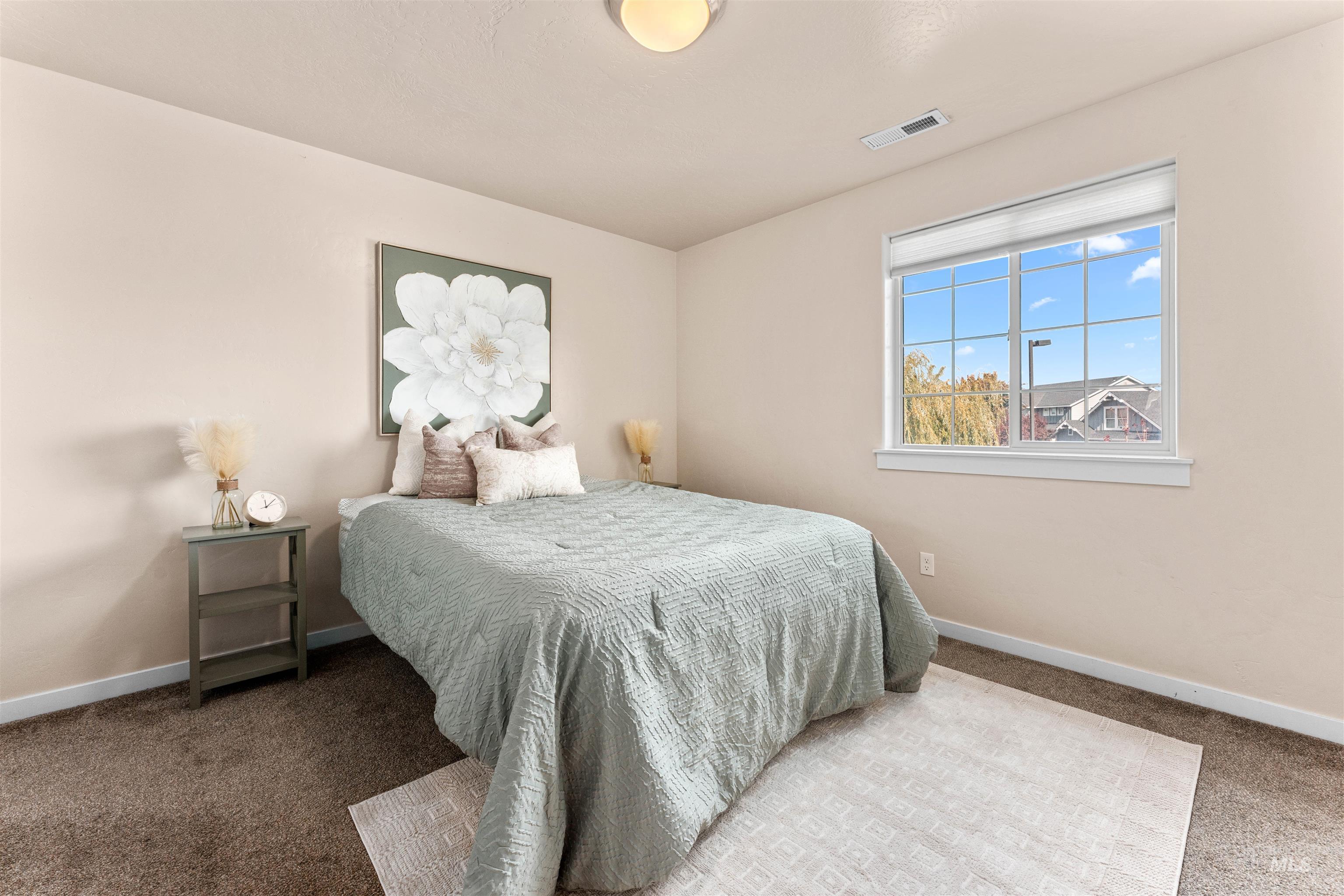 37 East Ensenada Drive Meridian, ID 83646 - Photo 24 of 46 Carpeted bedroom featuring baseboards