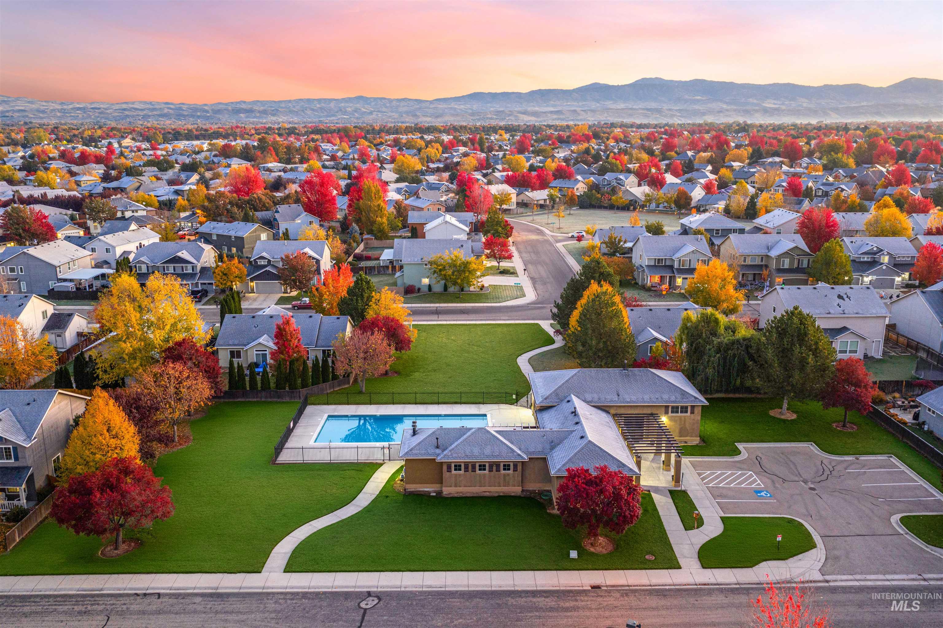 37 East Ensenada Drive Meridian, ID 83646 - Photo 3 of 46 Aerial view of residential area with a pool area and mountains