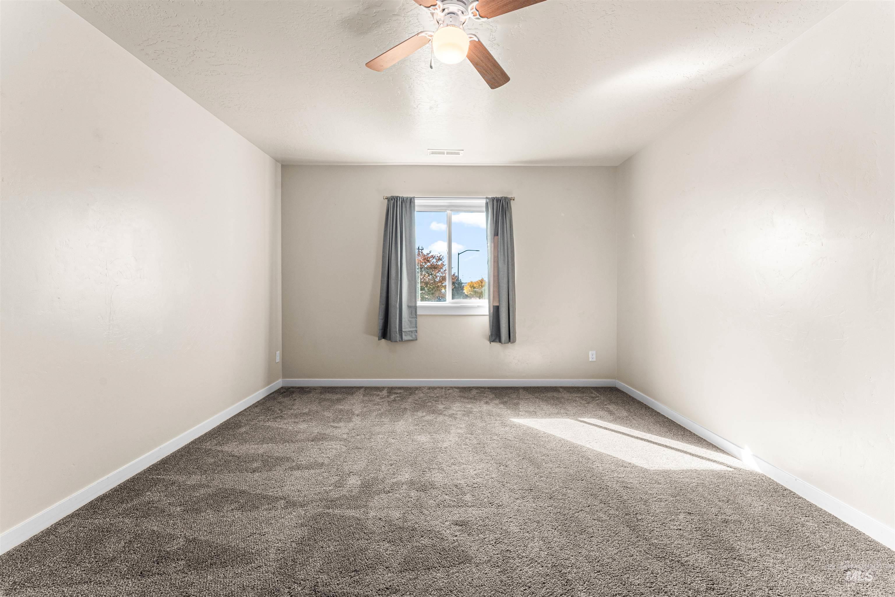 37 East Ensenada Drive Meridian, ID 83646 - Photo 31 of 46 Carpeted empty room with ceiling fan and a textured ceiling