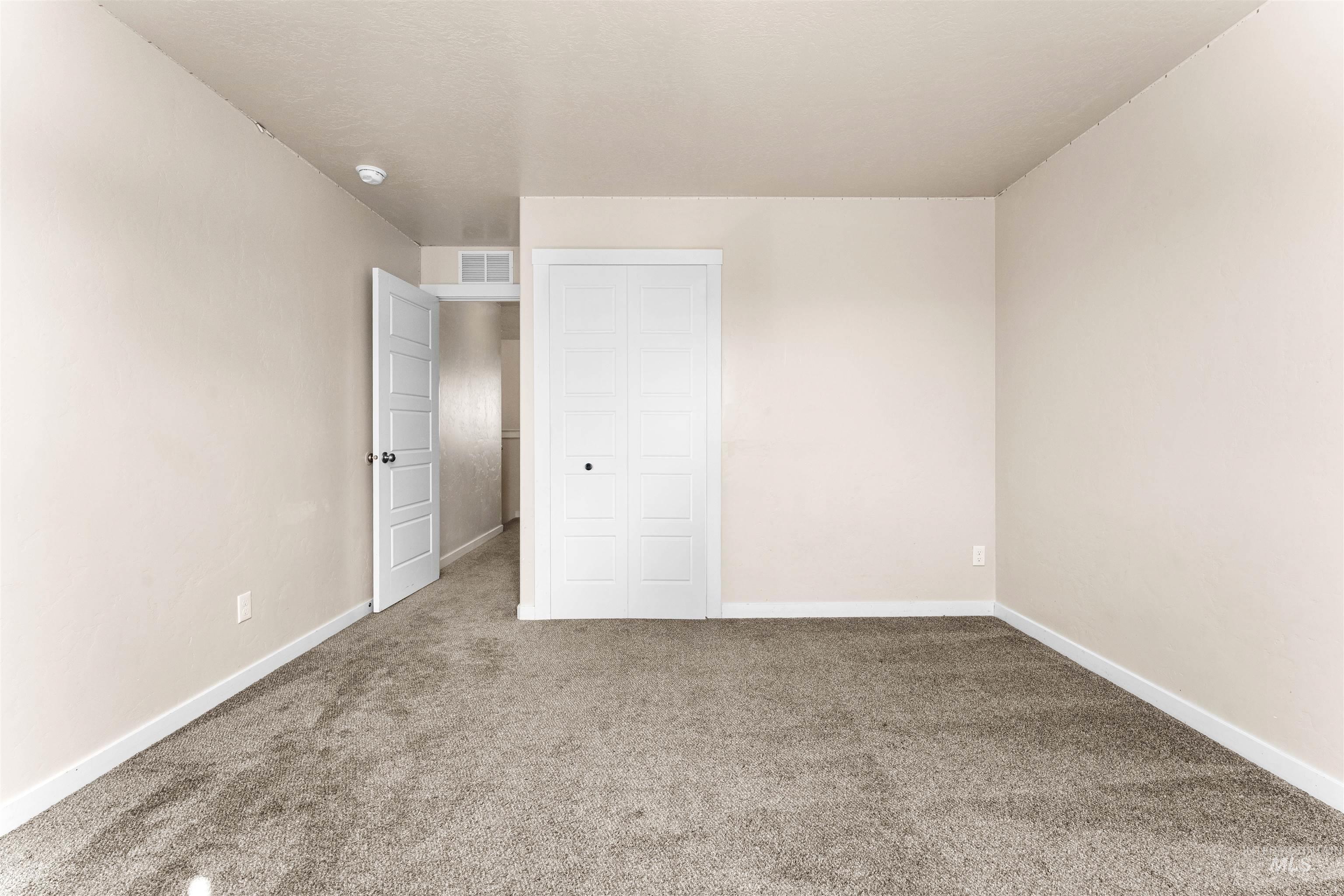 37 East Ensenada Drive Meridian, ID 83646 - Photo 35 of 46 Unfurnished bedroom featuring carpet floors and a closet