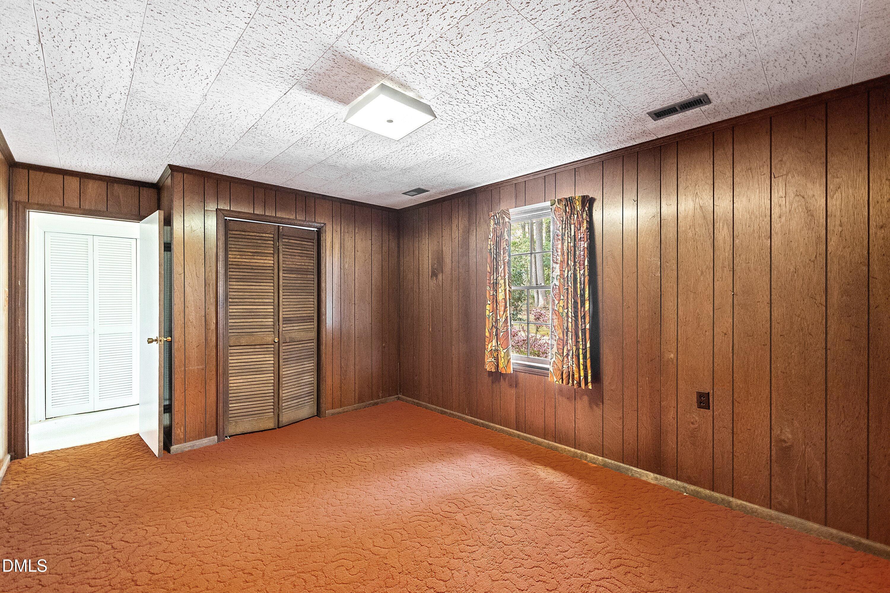 1429 Falls Church Road Raleigh, NC 27609 - Photo 18 of 60 an empty room with windows