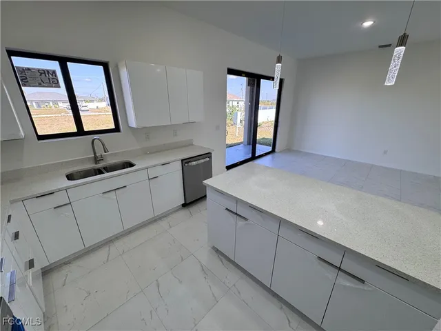 a kitchen with a sink and cabinets