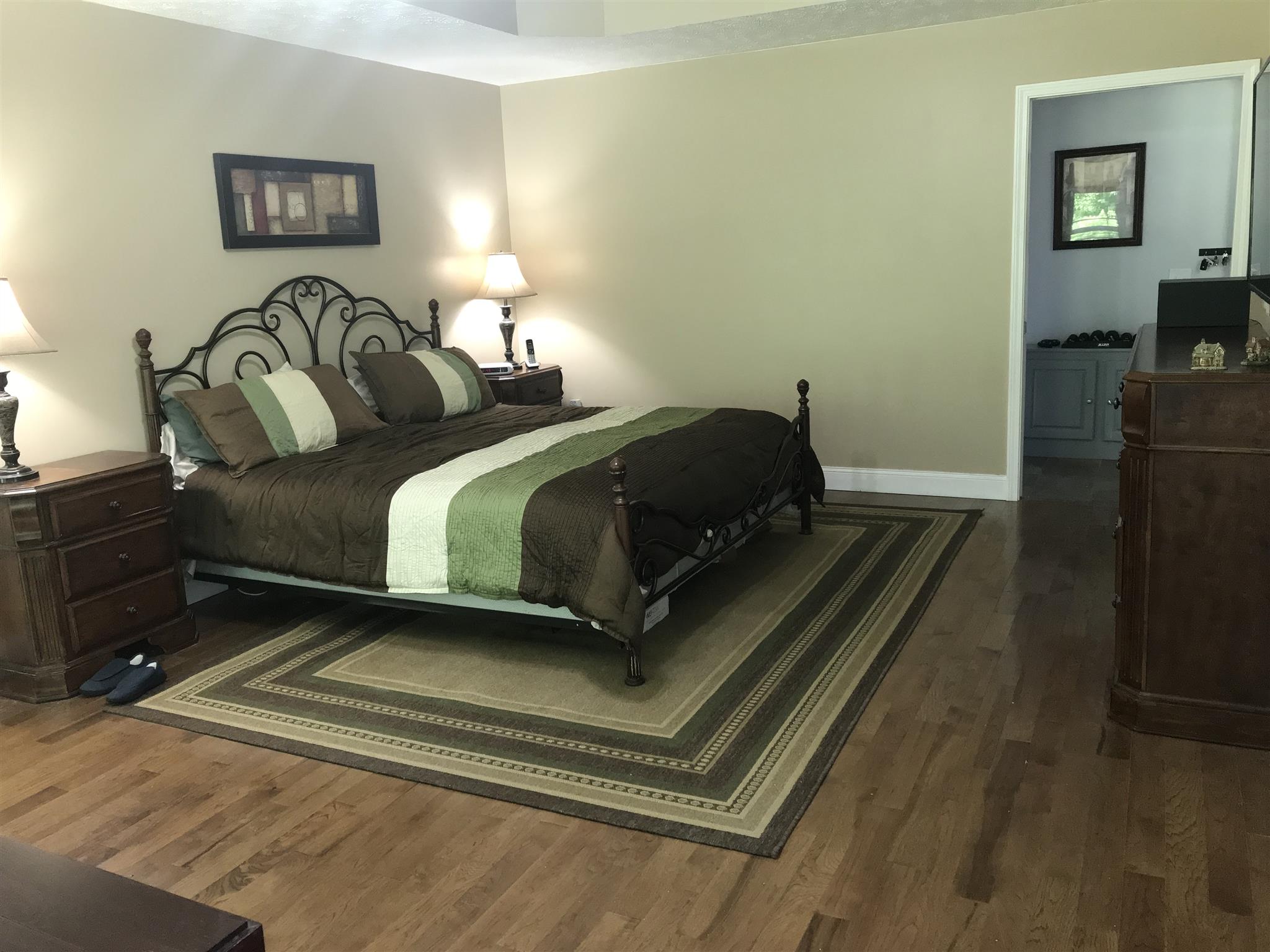 1276 Espy Road Manchester, TN 37355 - Photo 11 of 25 a bedroom with a bed and wooden floor
