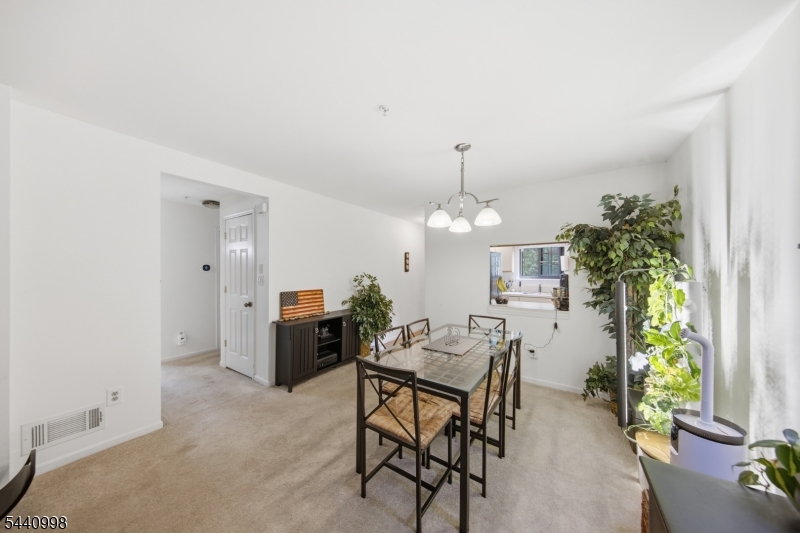 609 Mark Twain Way Mahwah, NJ 07430 - Photo 6 of 40 a view of a dining room with furniture and window