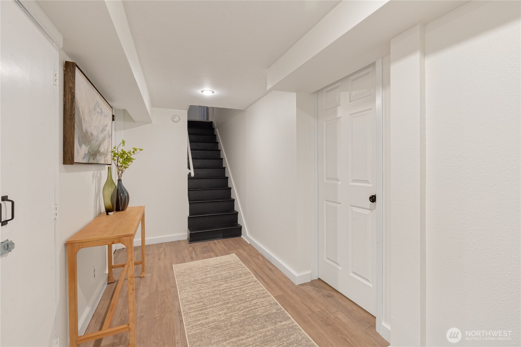 16406 Sylvester Road Southwest Burien, WA 98166 - Photo 13 of 28 a view of entryway and hall with wooden floor