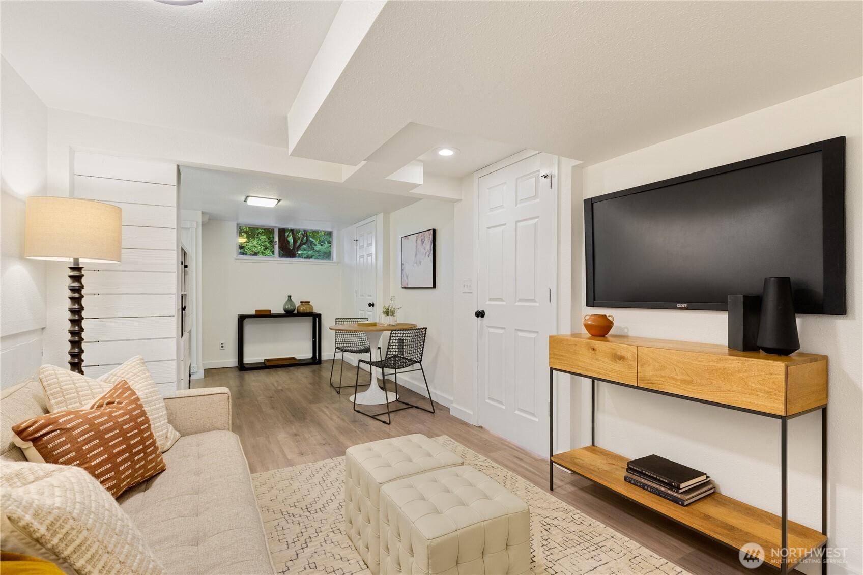 16406 Sylvester Road Southwest Burien, WA 98166 - Photo 15 of 28 a living room with furniture and a flat screen tv