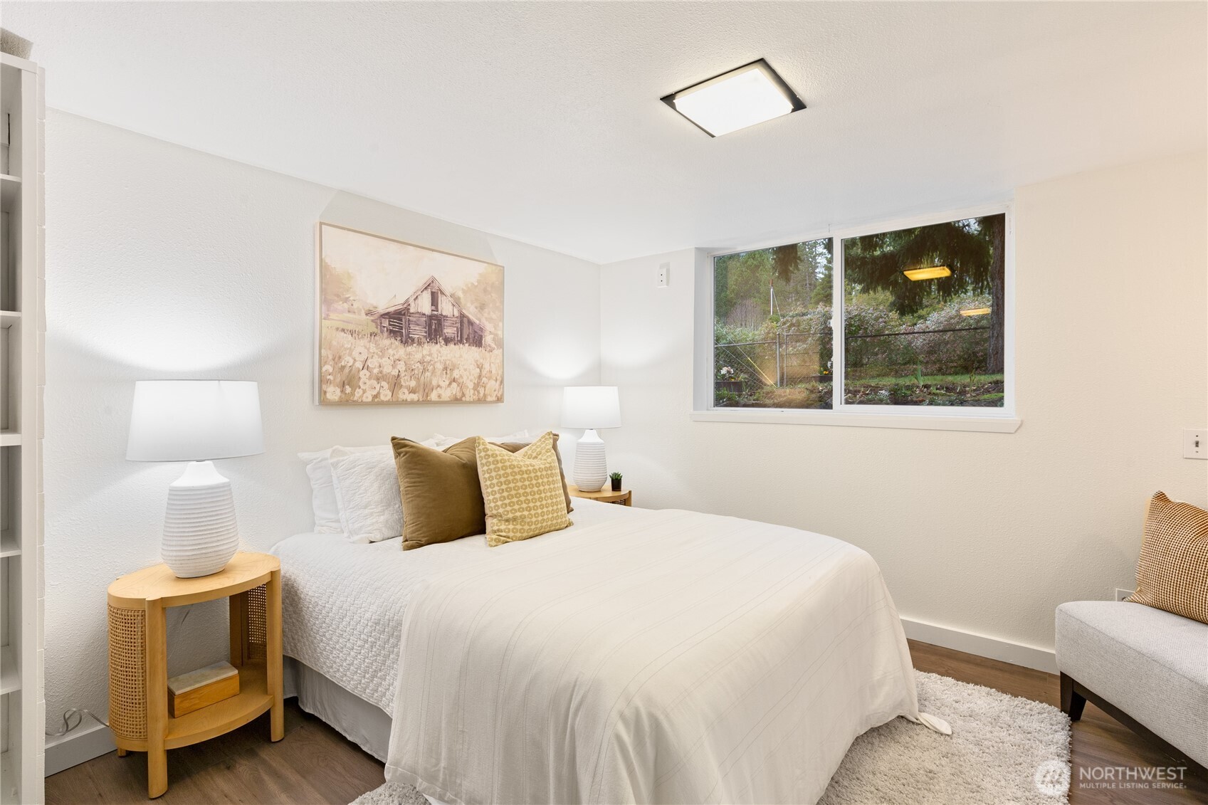 16406 Sylvester Road Southwest Burien, WA 98166 - Photo 17 of 28 a bedroom with a bed and a painting on the wall