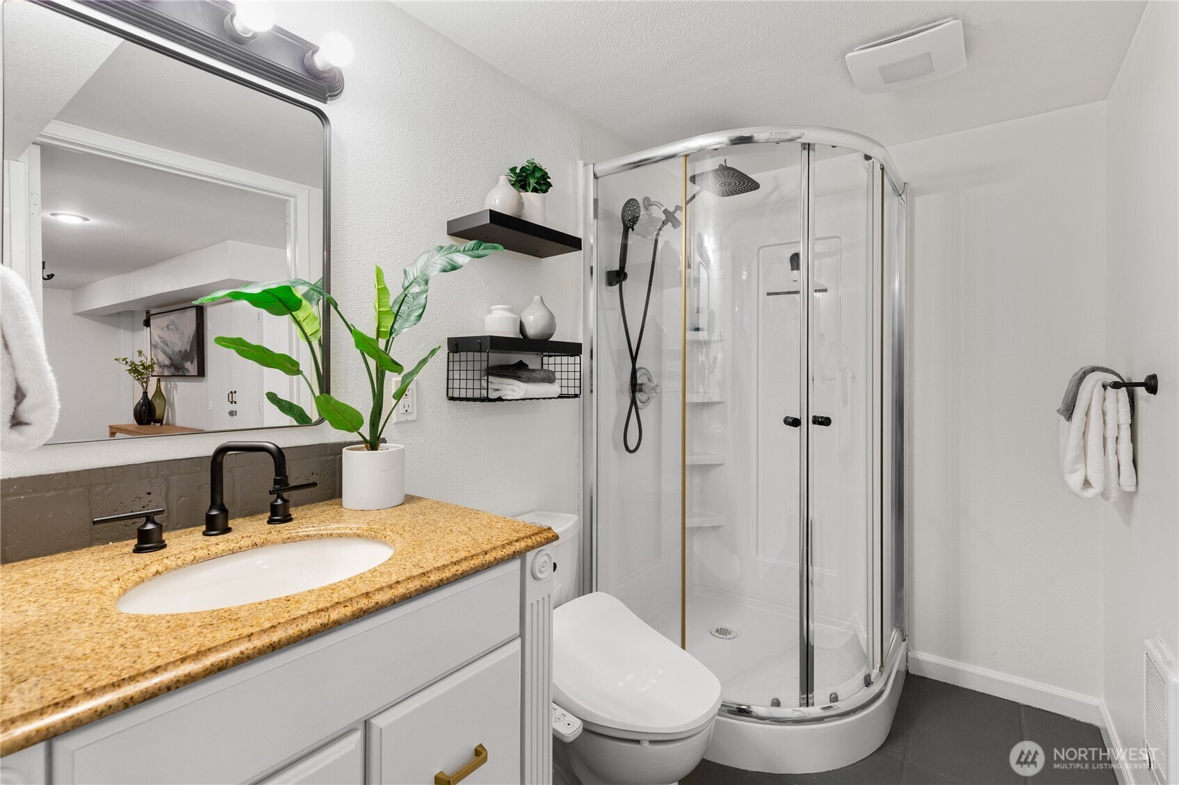 16406 Sylvester Road Southwest Burien, WA 98166 - Photo 19 of 28 a bathroom with a granite countertop sink toilet and shower