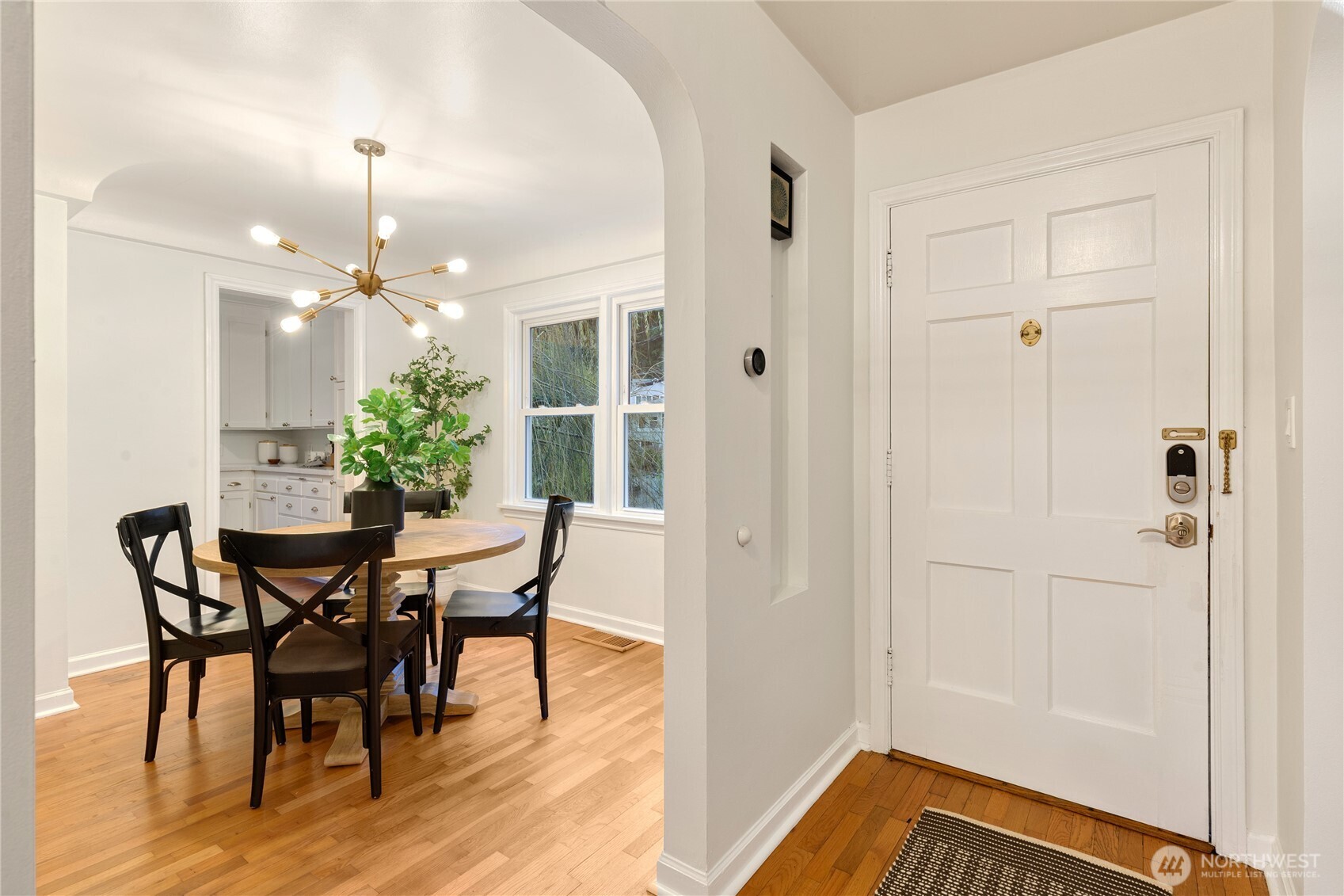 16406 Sylvester Road Southwest Burien, WA 98166 - Photo 2 of 28 a view of a dining room with furniture and wooden floor