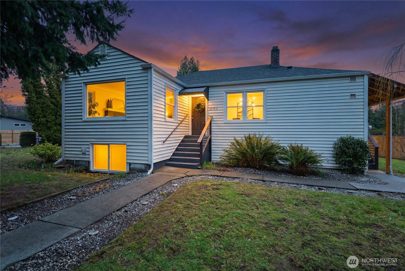 16406 Sylvester Road Southwest Burien, WA 98166 - Photo 22 of 28 a front view of a house with a yard