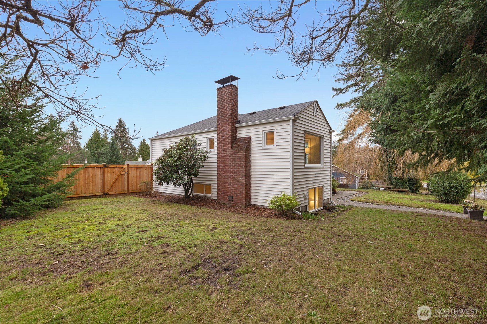 16406 Sylvester Road Southwest Burien, WA 98166 - Photo 23 of 28 a view of a house with a yard