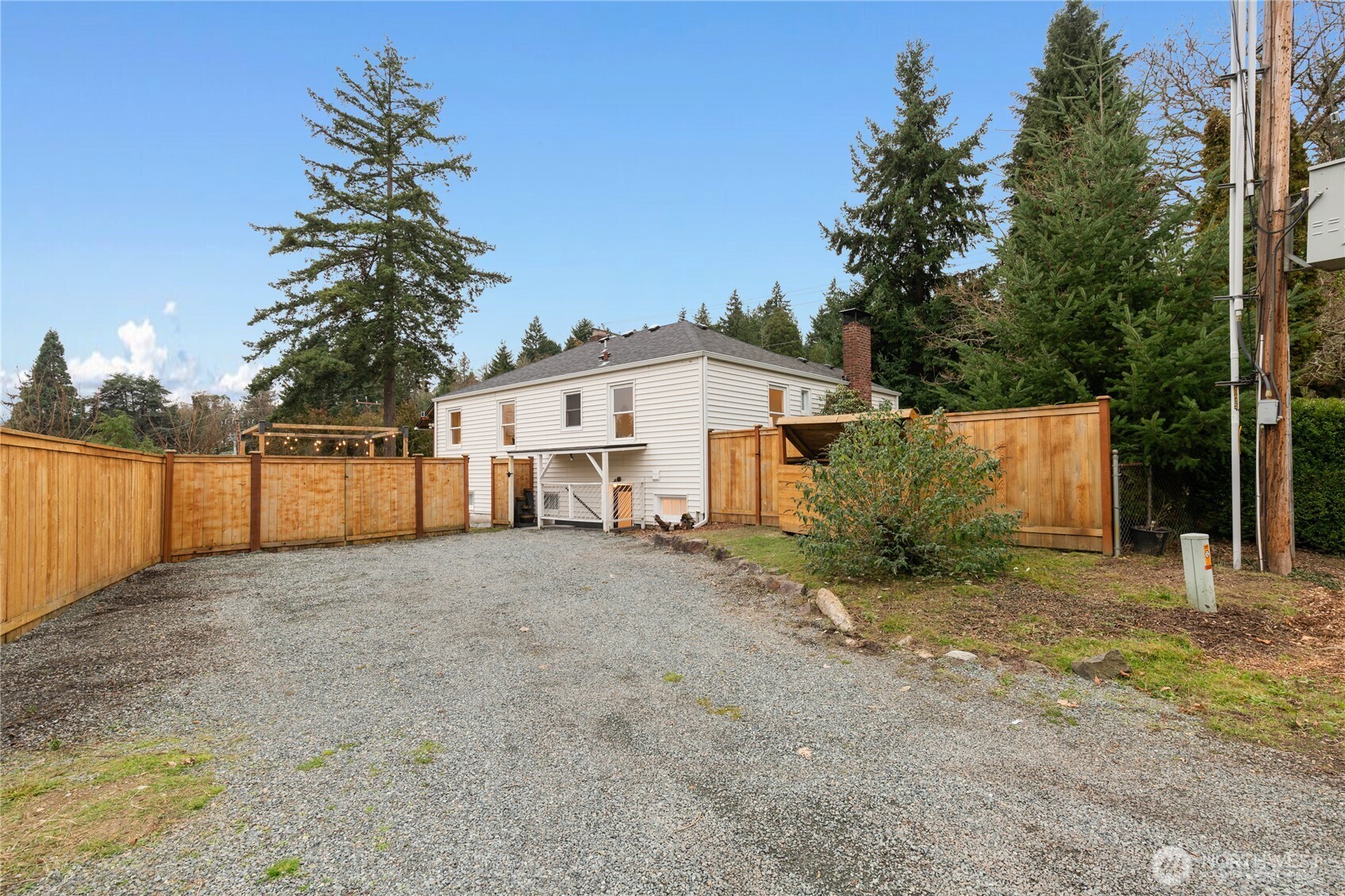 16406 Sylvester Road Southwest Burien, WA 98166 - Photo 24 of 28 a view of a house with a yard