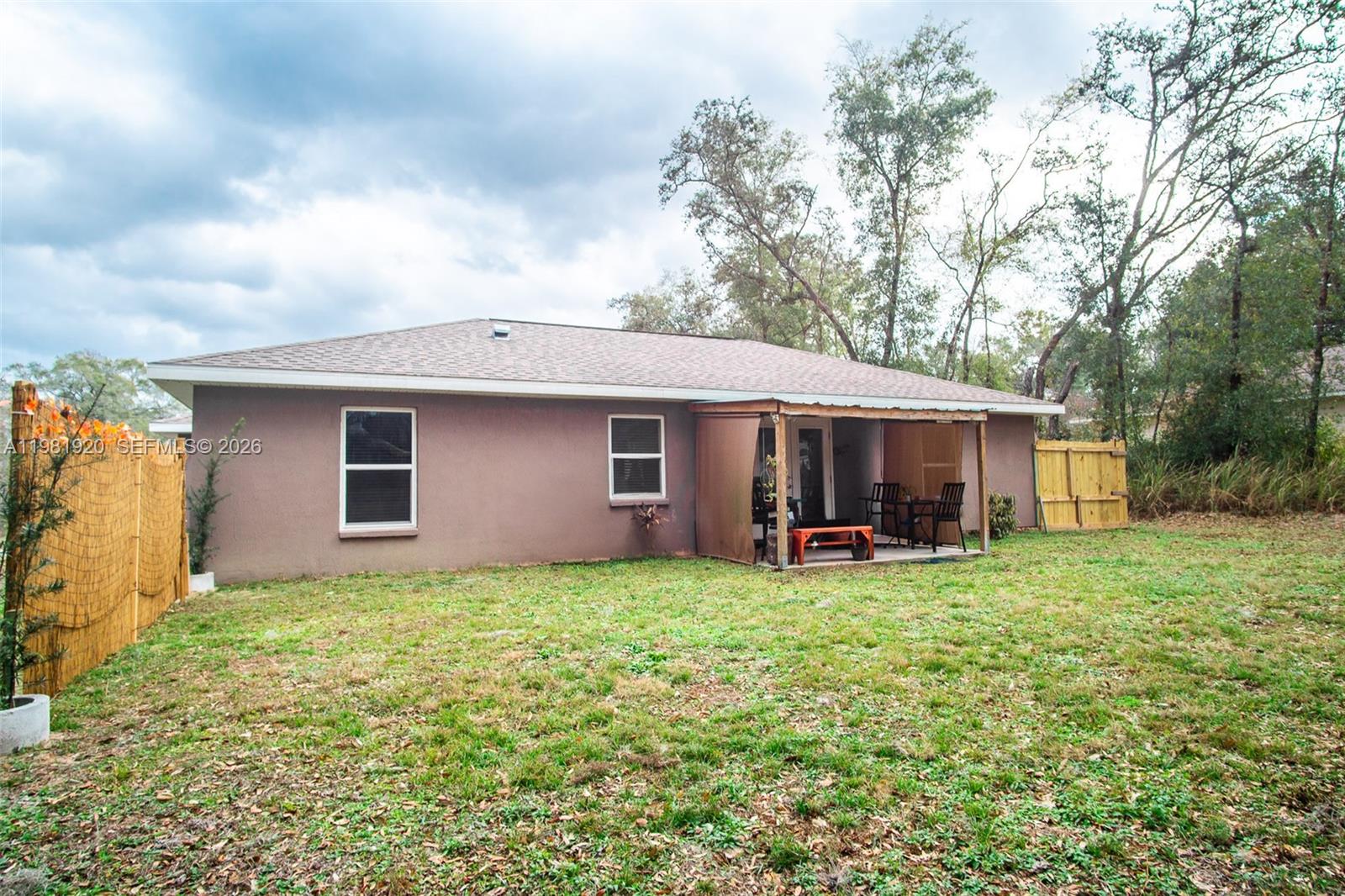 1123 East Bucknell Avenue Inverness, FL 34450 - Photo 3 of 13 a view of a house with a yard and sitting area
