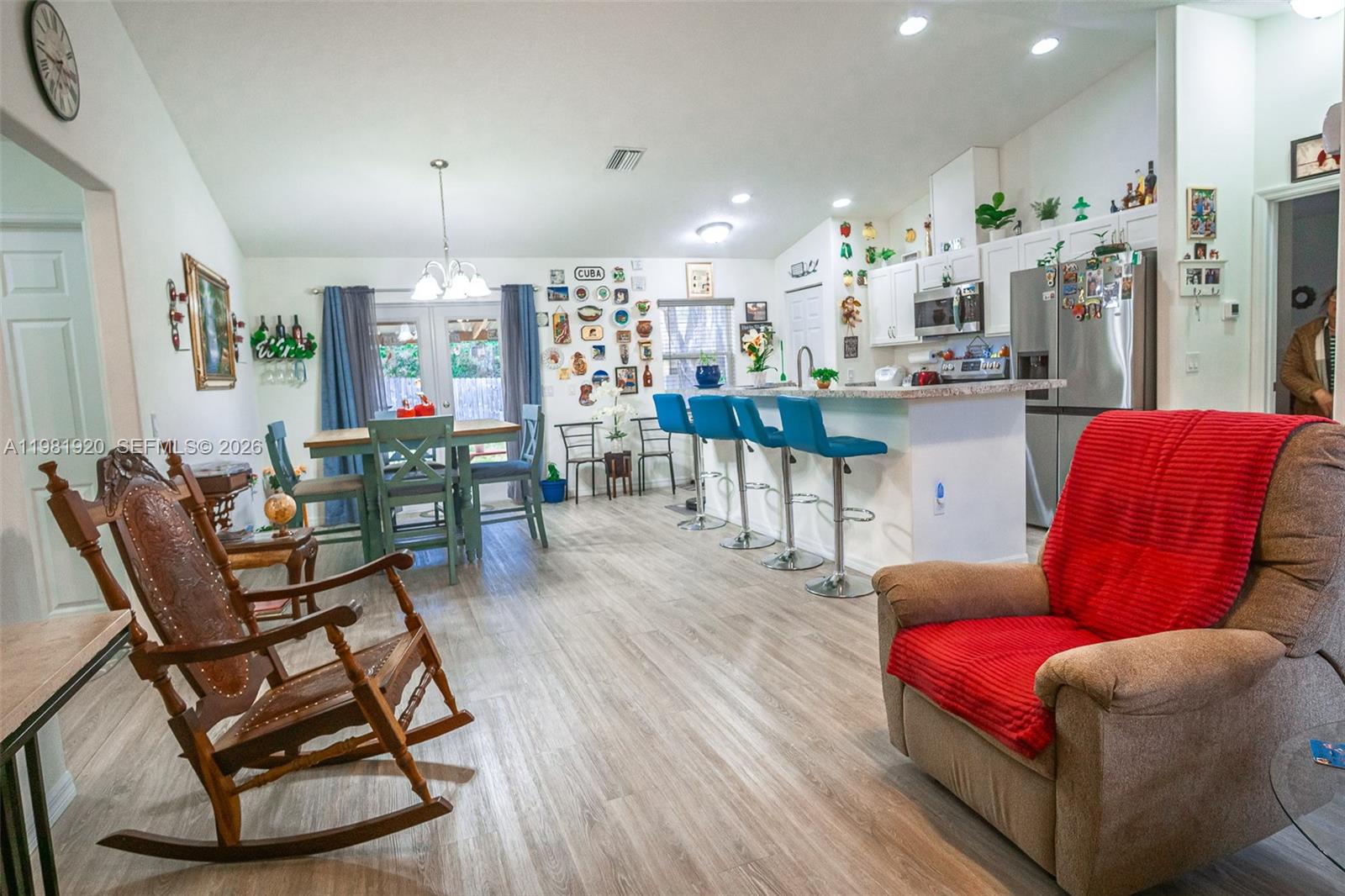 1123 East Bucknell Avenue Inverness, FL 34450 - Photo 7 of 13 a living room with furniture kitchen view and a wooden floor