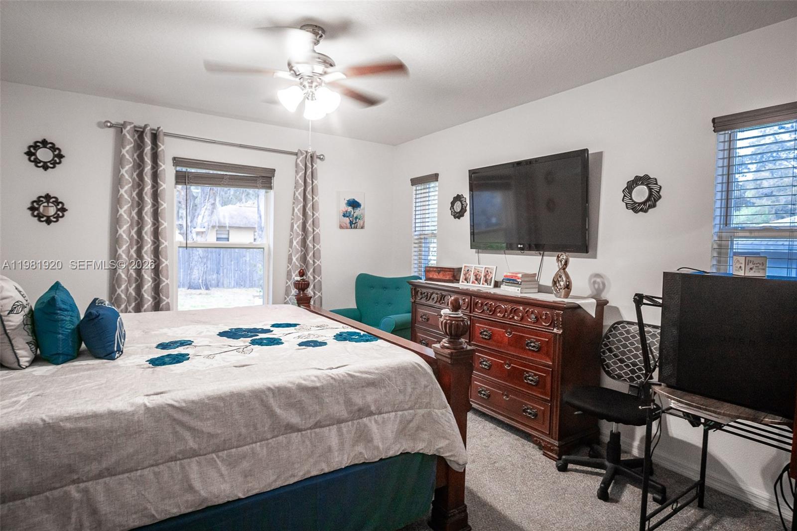 1123 East Bucknell Avenue Inverness, FL 34450 - Photo 10 of 13 a bedroom with a bed and a flat screen tv