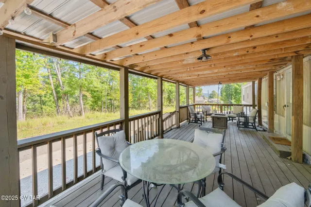 a dining room with furniture wooden floor and a table and chairs