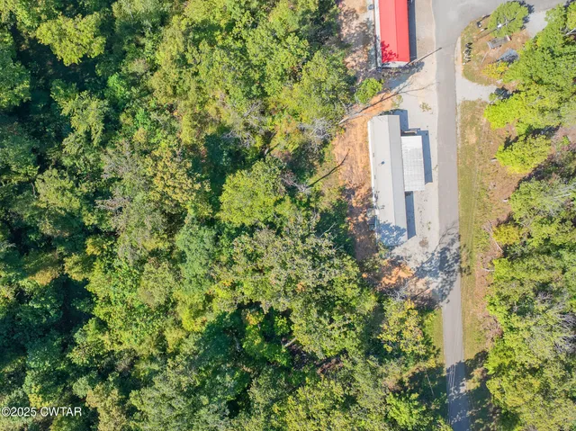 a view of a house with a tree